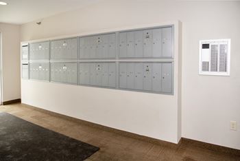 Secure mail lockers for package acceptance and delivery.